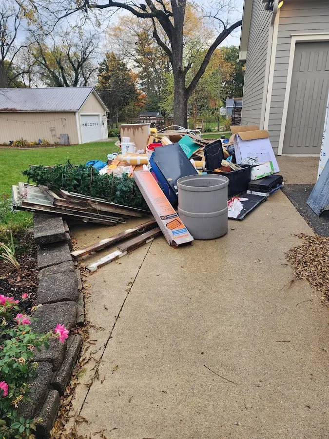 Dumpster being loaded with debris for Roofing Dumpster Rental in Radford